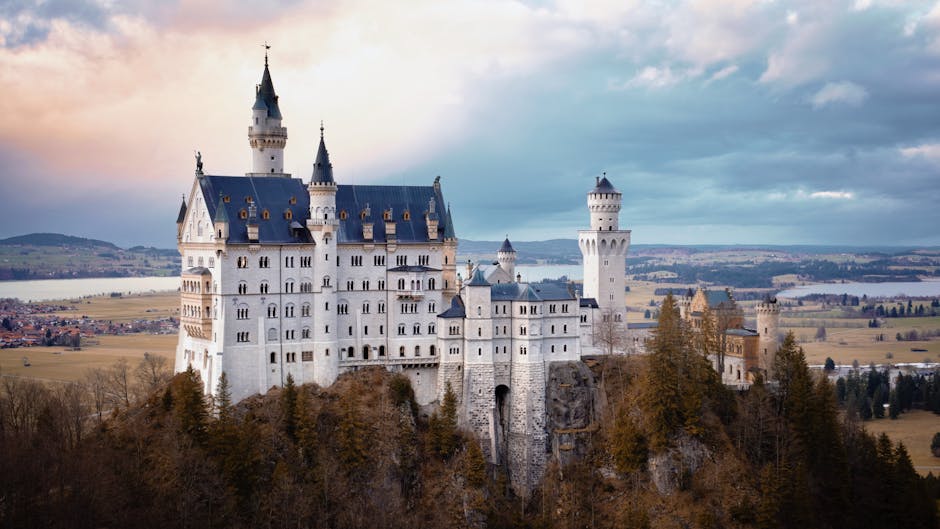 Stunning view of Neuschwanstein Castle amidst the Bavarian mountains and forests.